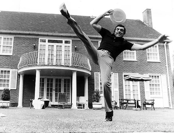 Frankie Vaughan singer does his high kick routine June 1974 holding his boater in