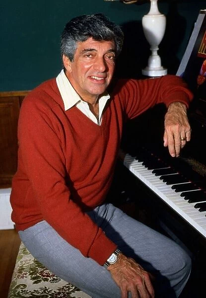 Frankie Vaughan sitting at piano December 1985