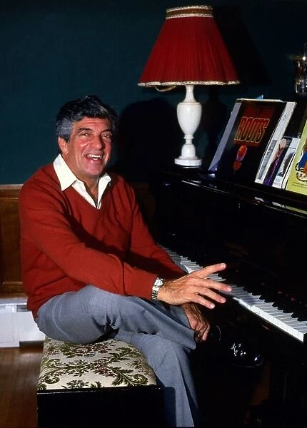 Frankie Vaughan sitting at piano December 1985