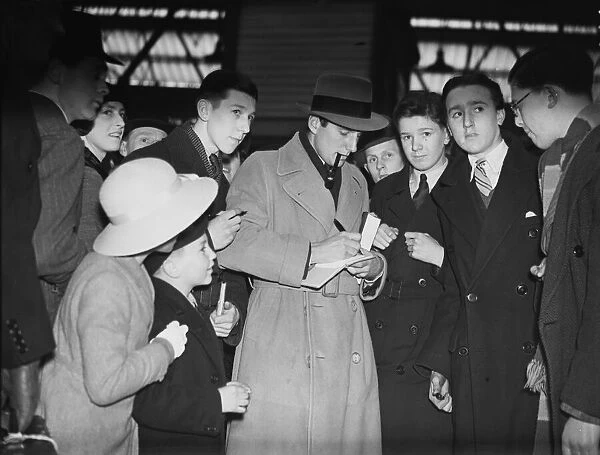 Fred Perry, British Tennis Player, signing autographs. Signing autographs