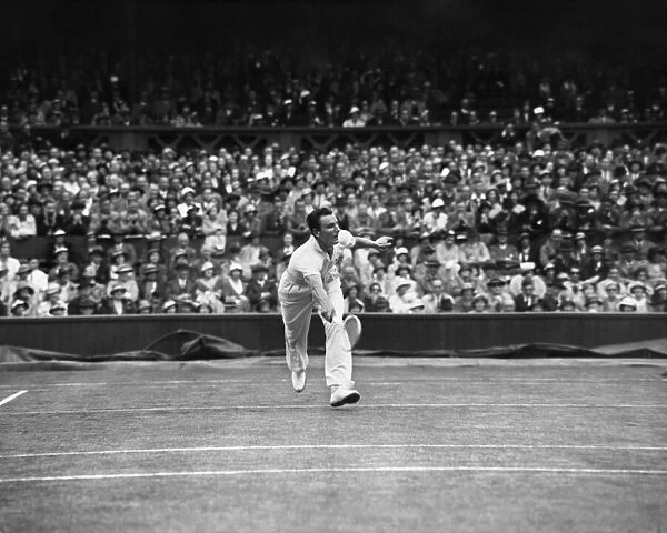 Fred Perry competing at The Mens singles Wimbledon Championships in 1934 on the centre