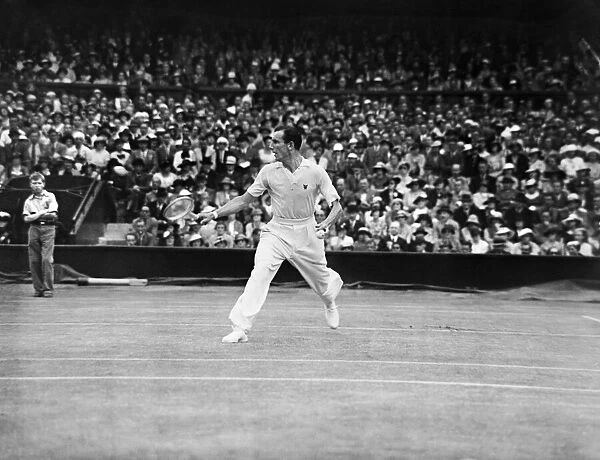 Fred Perry (GB) plays a back hand shot at The Mens Final at Wimbledon Tennis