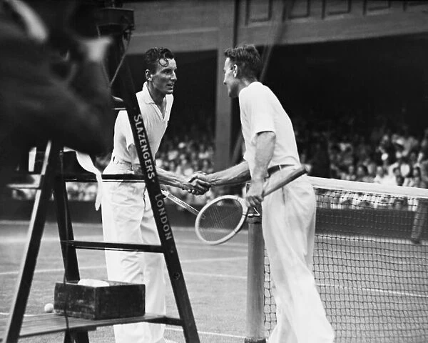 Fred Perry (GB) shakes hands with his opponent George Lott
