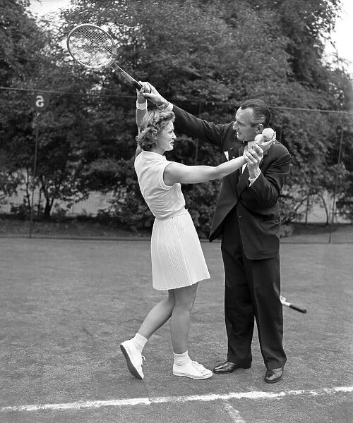 Fred Perry instructing Russian tennis players. 3rd July 1956