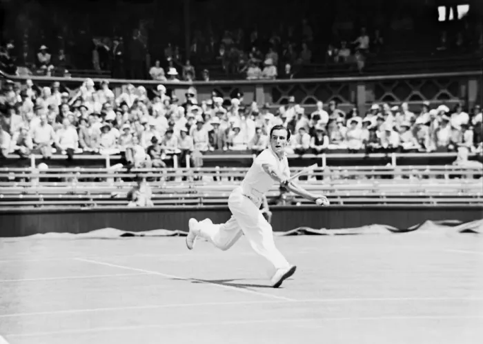 Framed Print : Fred Perry playing a backhand shot at The Wimbledon Mens Tennis Championships 1935