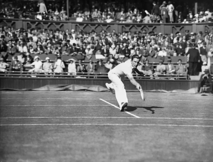 Framed Print : Fred Perry plays a back hand pass on The Centre Court at The Mens Wimbledon Tennis