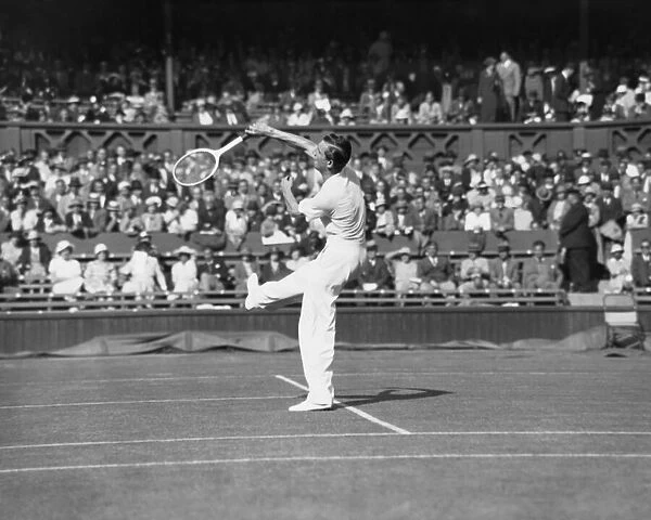 Fred Perry plays an overhead shot on The Centre Court at The Mens Wimbledon Tennis