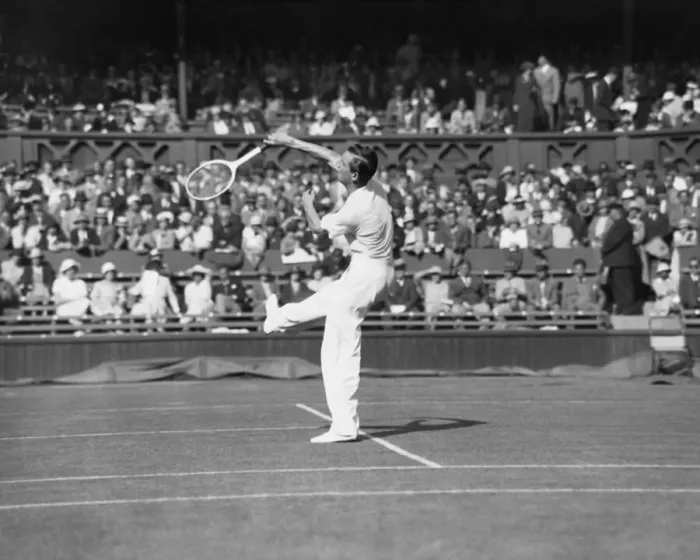 Framed Print : Fred Perry plays an overhead shot on The Centre Court at The Mens Wimbledon Tennis