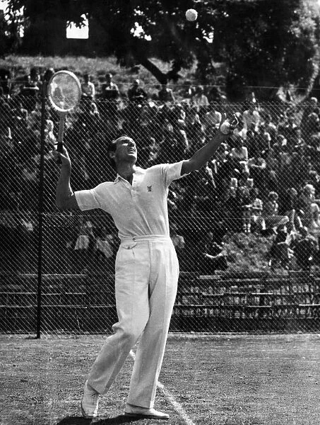 Fred Perry Tennis player demonstrates the service play during his exhibition at Cardiff
