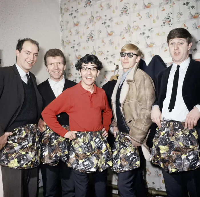 Framed Print : Freddie and the Dreamers pop group pose with swimming trunks presented to them by their