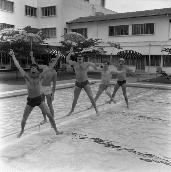 Framed Print : Freddie & the Dreamers Pop Group in Singapore March 1965 Jumping into swimming pool