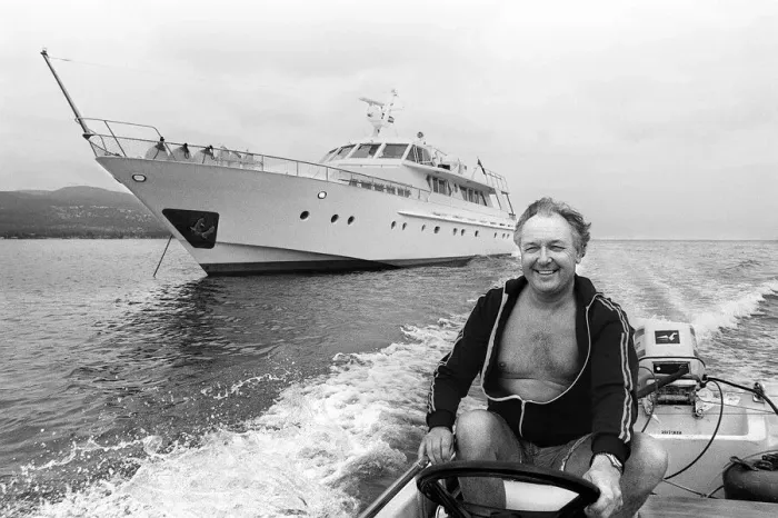 Framed Print : Freddie Laker chairman of Laker Airways July 1981 driving motor boat beside his Framed Print : Freddie Laker chairman of Laker Airways July 1981 driving motor boat beside his