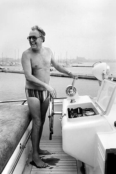 Freddie Laker: Entrepreneur with his motor cruiser in Majorca. July 1981 81-03733a-033