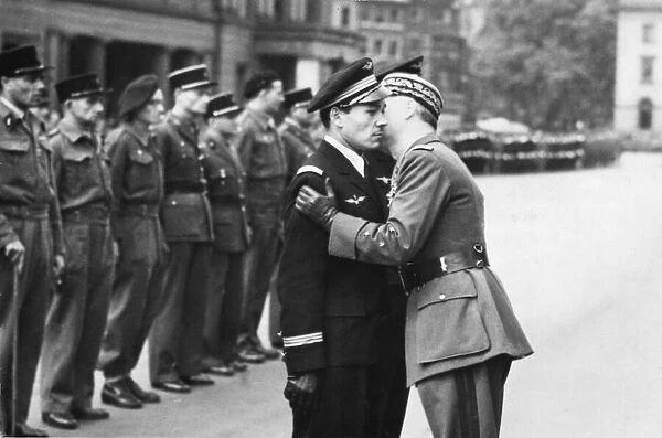 Free French celebrate Bastille Day in London. A kiss from general Le