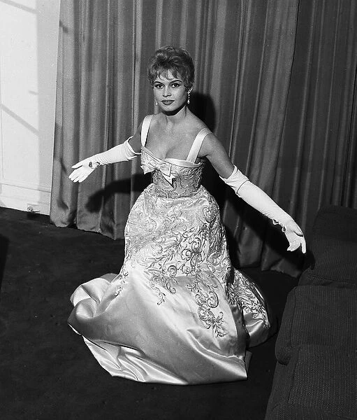 French actress Bridgitte Bardot rehearses her curtsy in anticipation of her meeting with