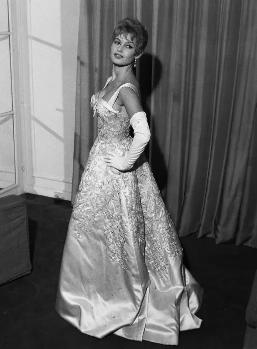 Framed Print : French actress Bridgitte Bardot rehearses her curtsy in anticipation of her meeting with