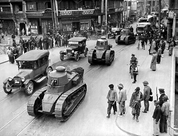 French Army Tanks rolling through the streets of Shanghai in China during the civil war