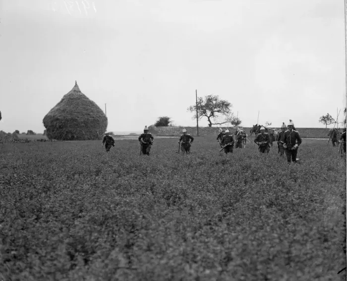 Framed Print : French cavalrymen dismounted seen here running across a corn field in Flanders