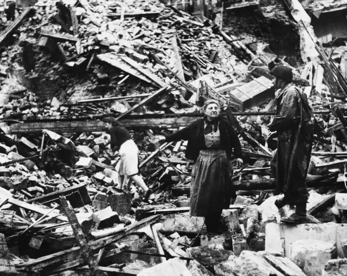 Framed Print : French civilians search through bombed ruins during Second World War somewhere in France