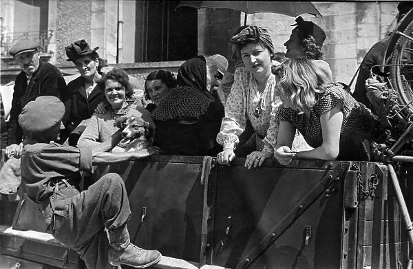 French families being transported to new homes from the war torn Northern French city of