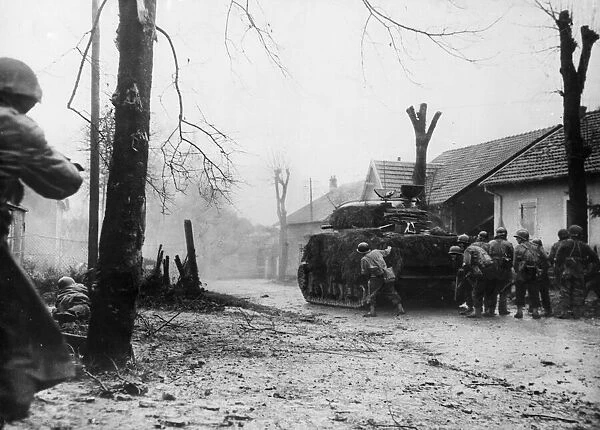 A French tank fires at an enemy position on the outskirts of Belfort, France