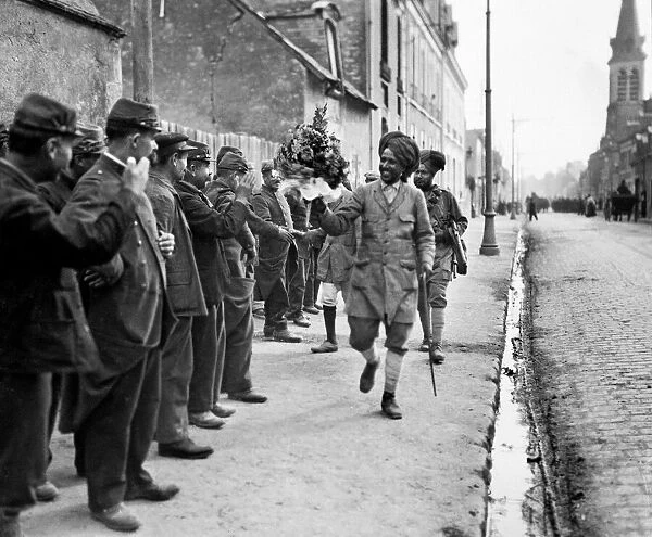 French troops shaking hands and giving floral bouquets to the Indian soldiers as they