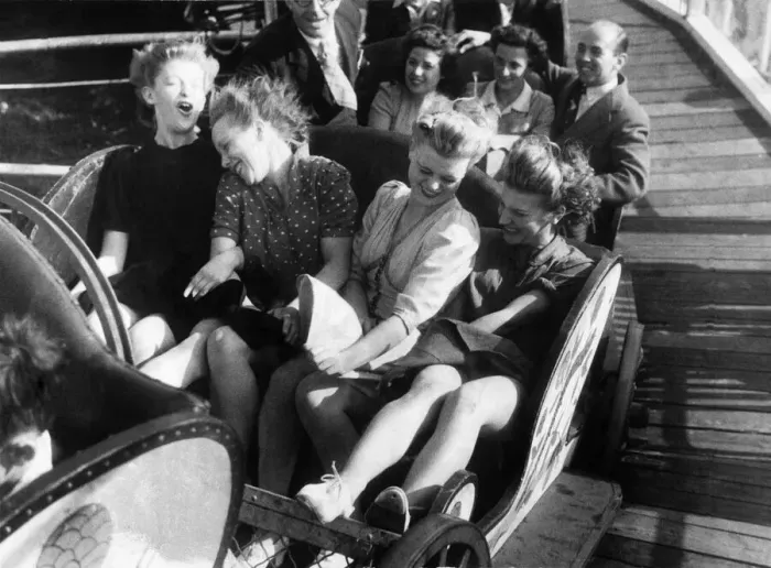 Framed Print : Four friends enjoy a fairground ride during the August Bank Holidays. August 1946 P000019