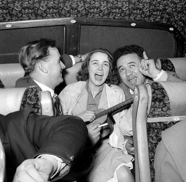 Friends enjoying a joke and a laugh on a coach trip to Manchester. July 1955 A322