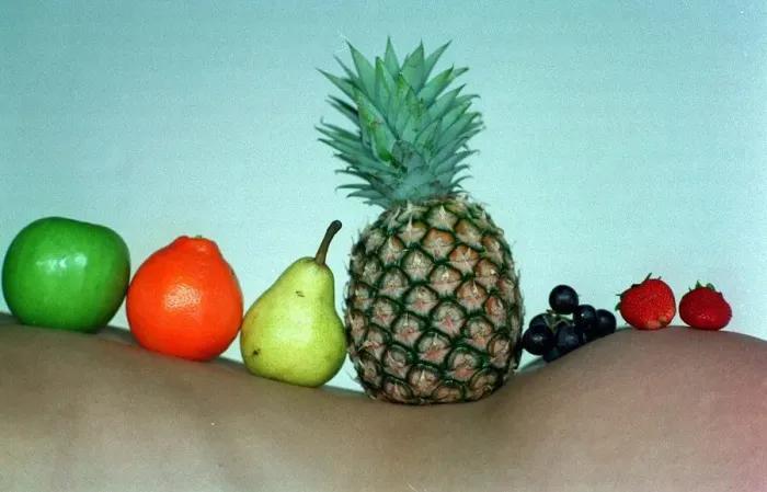 Framed Print : Fruit nude model with orange pear March 1998 Pineapple grapes strawberries resting