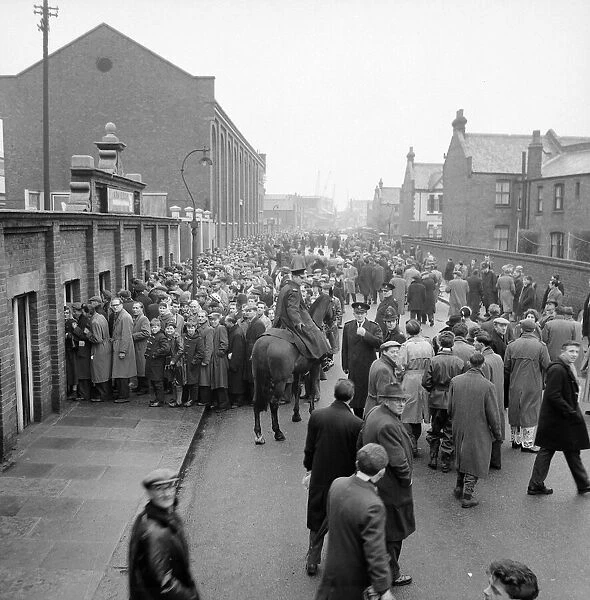 Fulham fans queue at Craven Cottage as tickets for their FA Cup match against Charlton