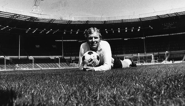Fulham footballer Bobby Moore lying on the Wembley turf in an empty stadium before