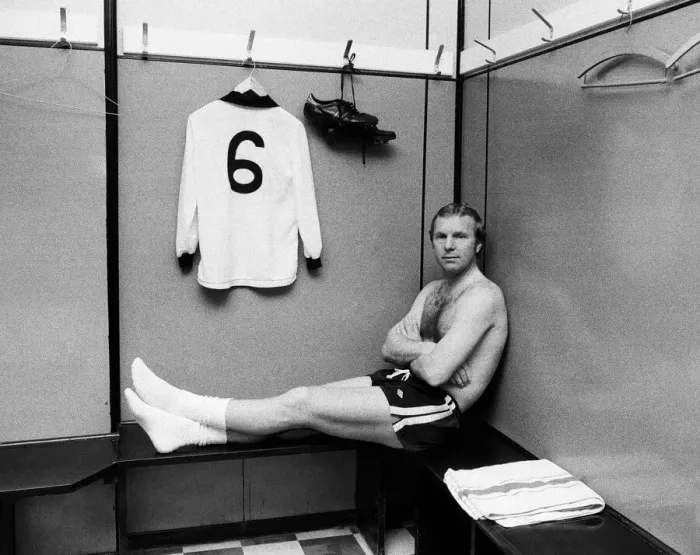 Framed Print : Fulham footballer Bobby Moore sits alone in the dressing room at Craven Cottage with his Framed Print : Fulham footballer Bobby Moore sits alone in the dressing room at Craven Cottage with his