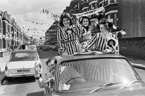 Fulham supporters on the way to Wembley Stadium to see their team take part in the FA Cup