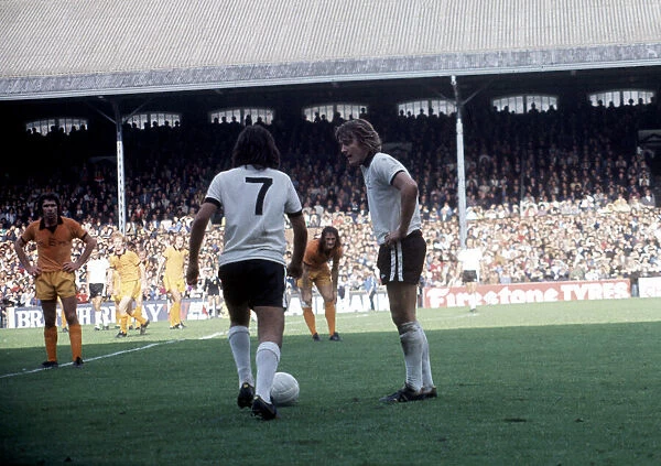 Fulham v Wolverhampton Wanderers. Rodney Marsh and George Best take a free kick