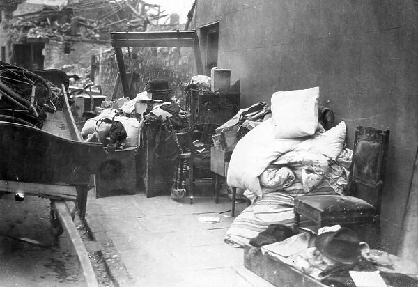 Furniture and bedding from a blitzed building in Roath, Cardiff. Circa 1941