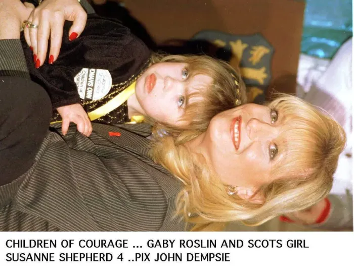 Framed Print : Gaby Roslin cuddles Suzanne Shephard - one of 1995 Children of courage the Ayrshire girl Framed Print : Gaby Roslin cuddles Suzanne Shephard - one of 1995 Children of courage the Ayrshire girl