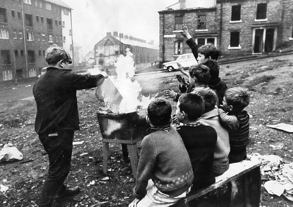 A gang of children risks injury playing with fire on wasteland at Beaumont Street