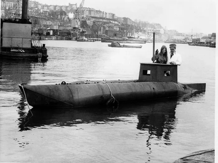 Framed Print : Garage owner Douglas Price with daughter Zena in the semi submarine he built called