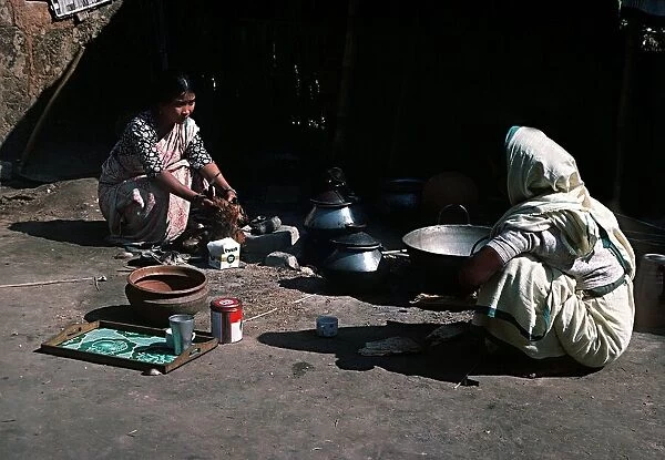 Garo women preparing meal at Garo village in Keoachola North of Dacca Bangladesh
