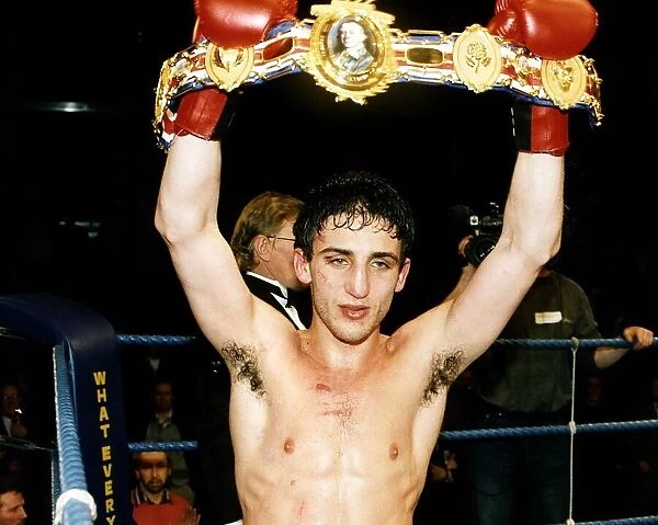 Gary Jacobs boxer holding up his title belt red gloves, 1992