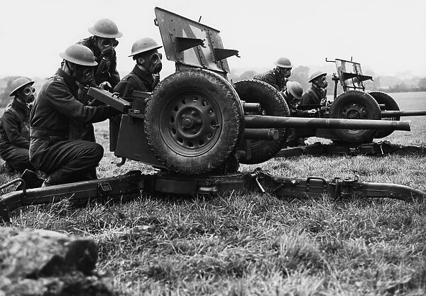 Gas masked anti-tank gun crews in a training exercise prior to the outbreak of WWII
