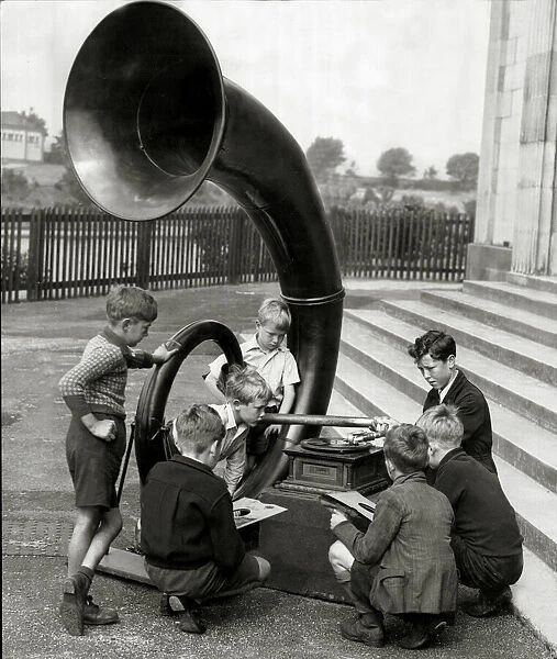 Gathering of young lads with a giant antiquated gramphone. 11th July 1944