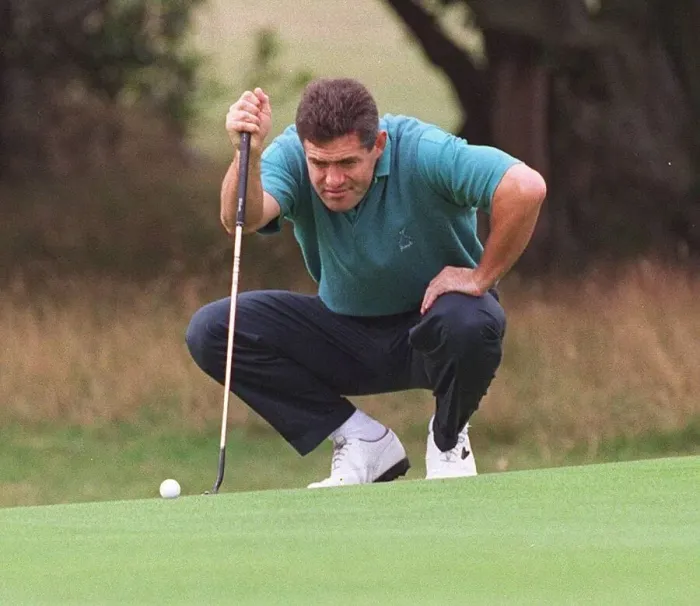 Framed Print : Gavin Hastings rugby player taking a serious look at putt at Dalmahoy golf