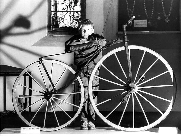 Gavin Snowdon aged 10, with a boneshaker, aged 107 at the Woodhorn Museum