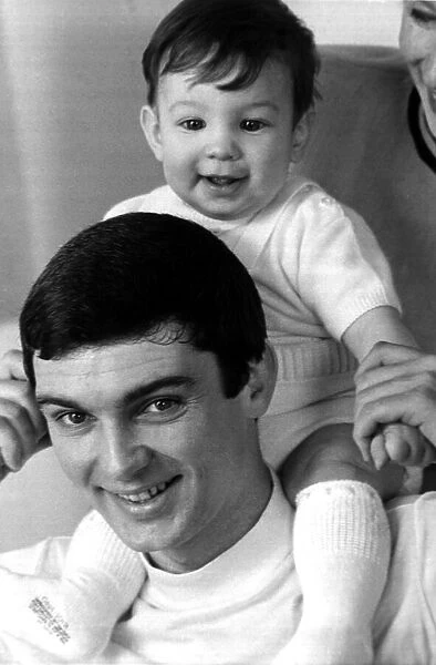Gene Pitney holding his seven month old son, Tom March 1968