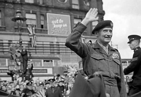 General Bernard Montgomery waves to the crowd on his way to Lambeth after World War Two