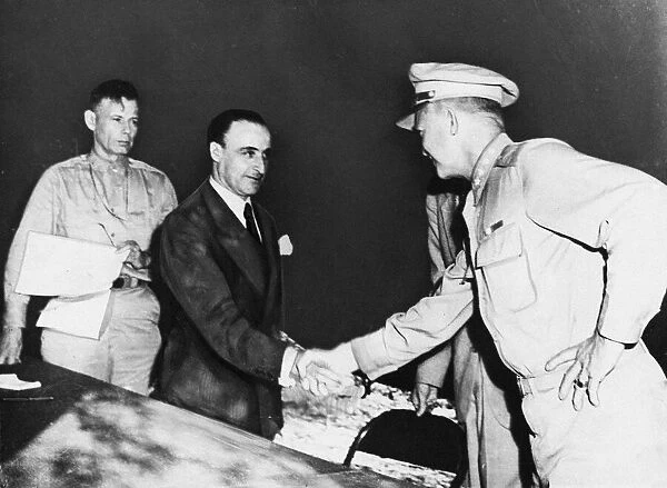 General Castellano shakes hands with General Eisenhower after signing the armistice
