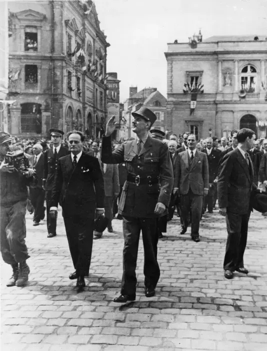 Framed Print : General De Gaulle waves to the wildly cheering crowds of his countrymen as he Framed Print : General De Gaulle waves to the wildly cheering crowds of his countrymen as he