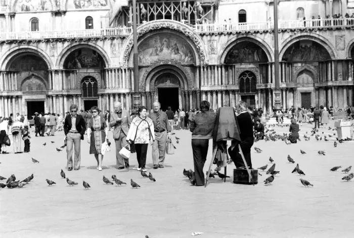 Framed Print : General scenes in Venice. Tourist walk past a photographer using a old style glass plate Framed Print : General scenes in Venice. Tourist walk past a photographer using a old style glass plate