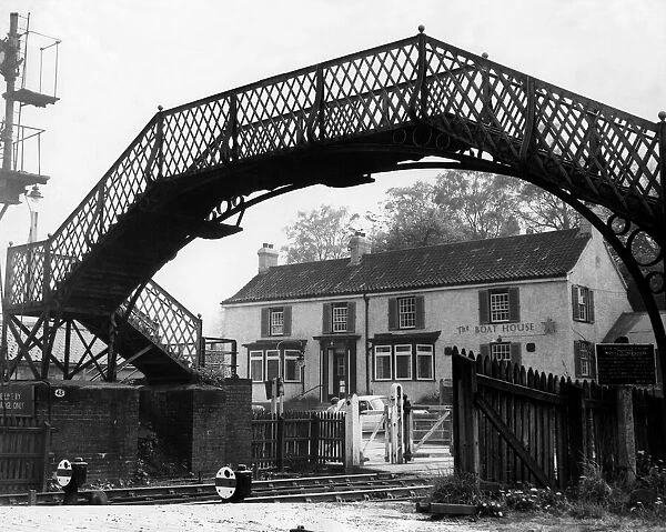 A general view of The Boat House pub and footbridge from the platform of Wylam Railway